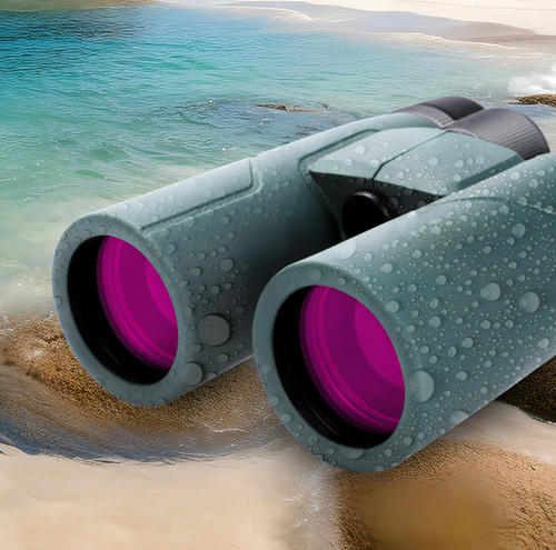 AuraLink Binoculars with pink lenses on a beach