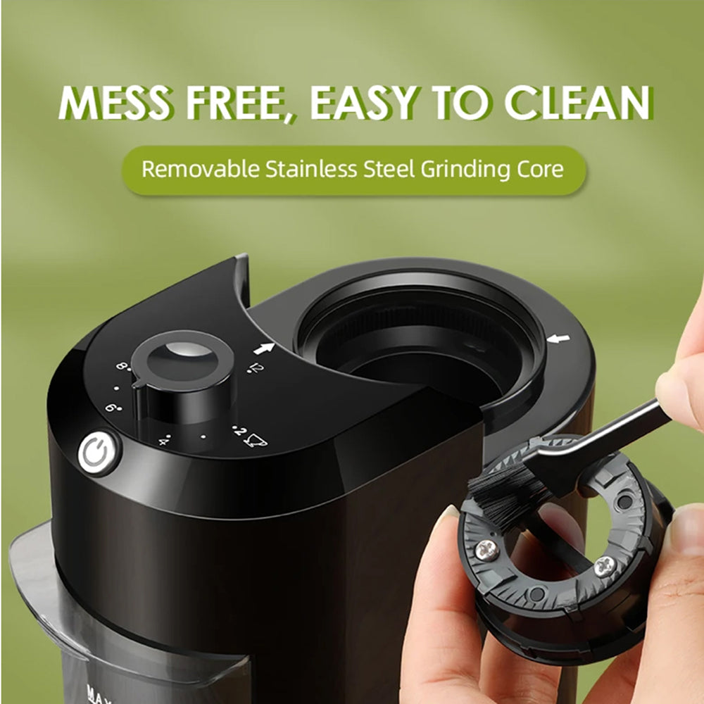 Black BrewixMi Coffee Grinder with removable stainless steel grinding core on a green background