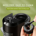 Black BrewixMi Coffee Grinder with removable stainless steel grinding core on a green background