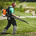 Man using a CleNolif 52CC Backpack Leaf Blower in a grassy outdoor setting