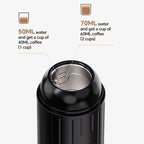 Black coffee maker with water measurement details on a white background