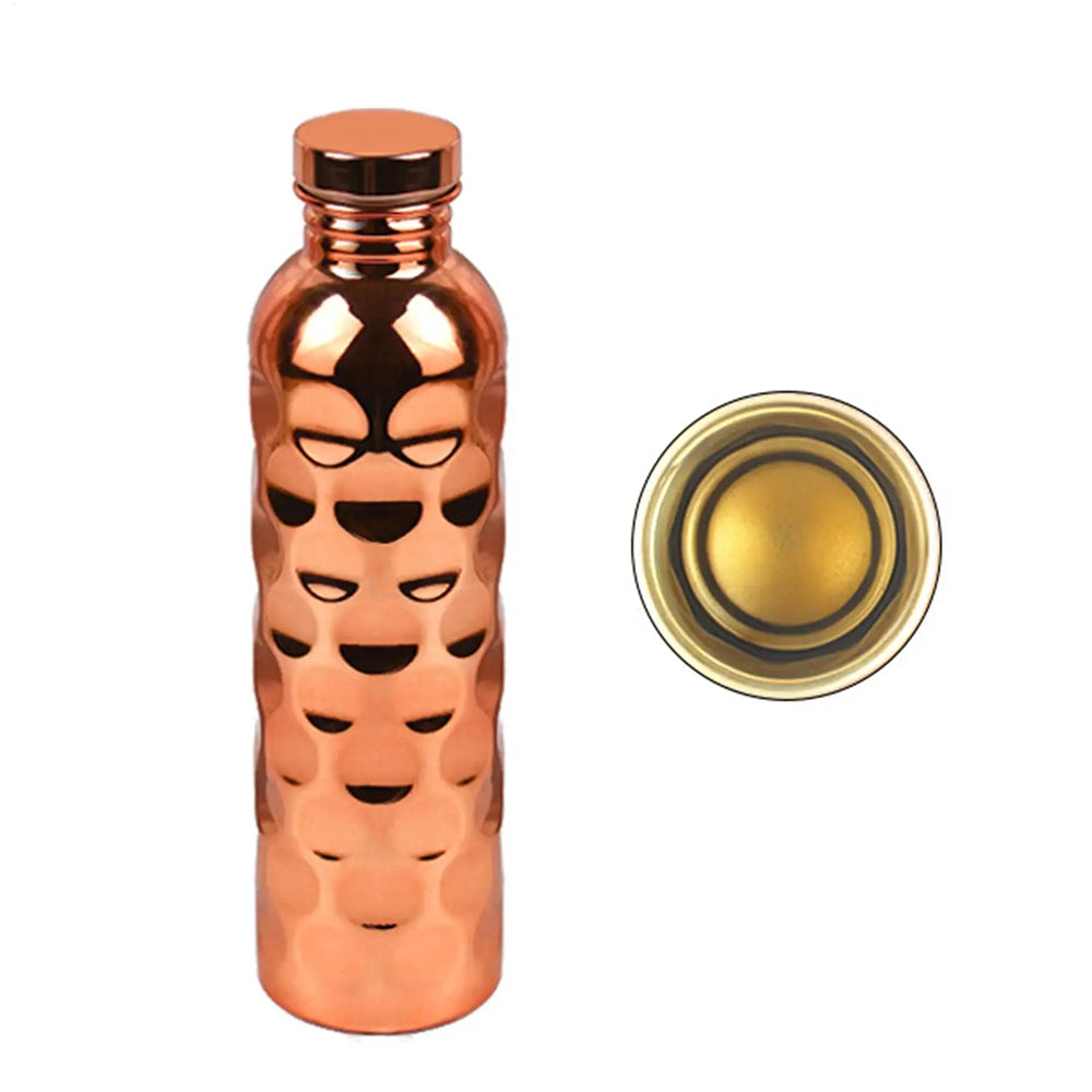 A CopperSyp Copper Water Bottle with a textured, hammered pattern and a matching cap, shown alongside a circular inset of the gold-toned interior of the cap.