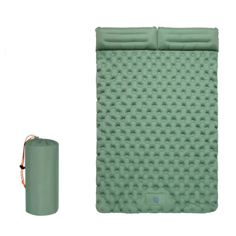 A mint green inflatable sleeping pad shown inflated next to its matching cylindrical carrying bag with an orange drawstring, on a solid white background.