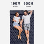 Two people lying on an inflatable DuoRestor Pro Camping Mattress with dimensions displayed.