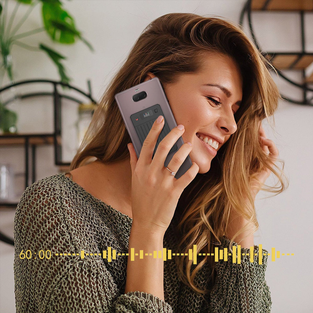 Woman talking on a phone with Evove Al Smart Voice Recorder a blurred background