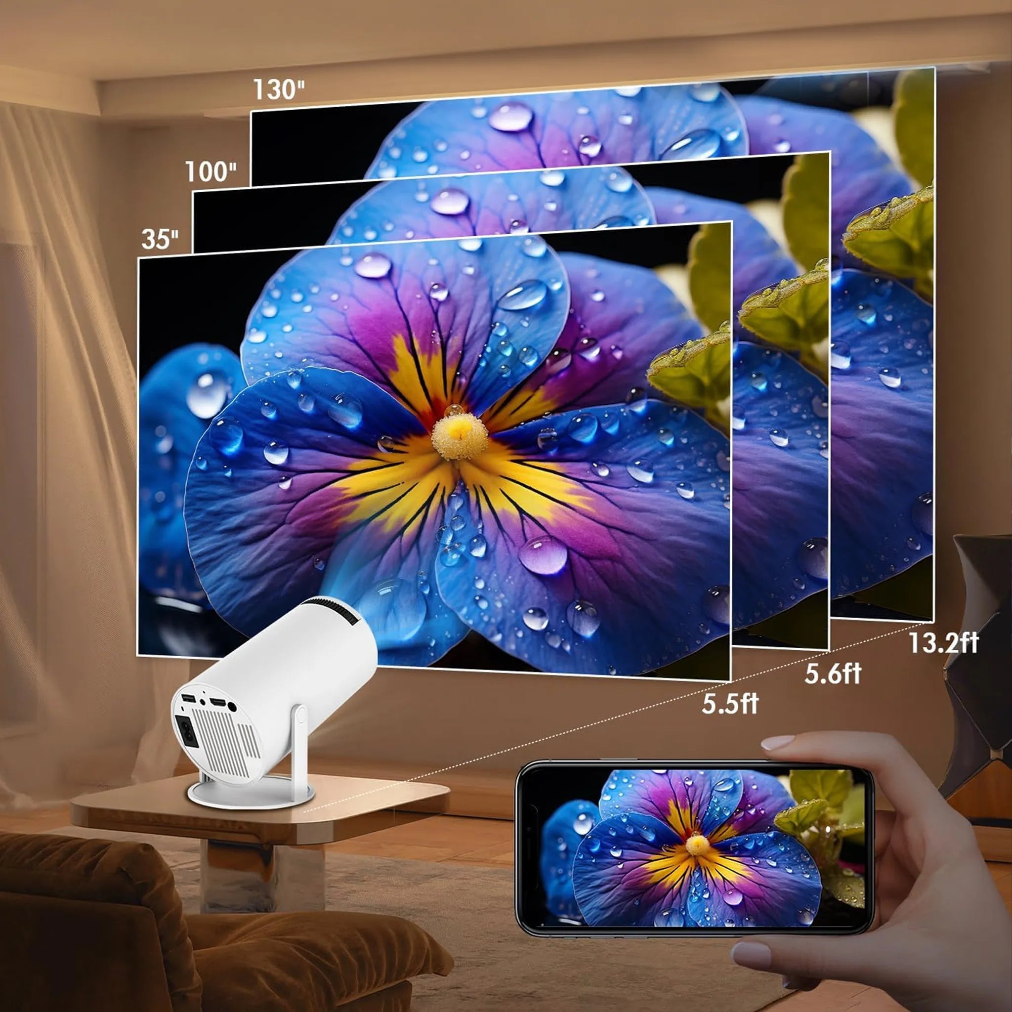 Smart TV displaying a colorful flower with a Evove Mini Portable Projector and smartphone showing the same image.