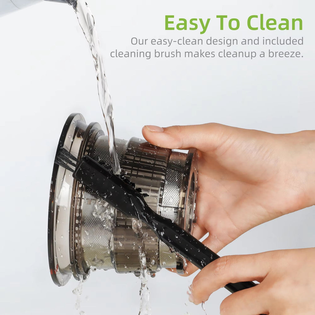 Hand holding a FruitTusii Cold Press Juicer brush with water being poured over it, text 'Easy To Clean' and 'included cleaning brush makes cleanup a breeze.'.