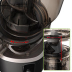 Close-up of a black and silver FruitTusii Cold Press Juicer with control panel details.