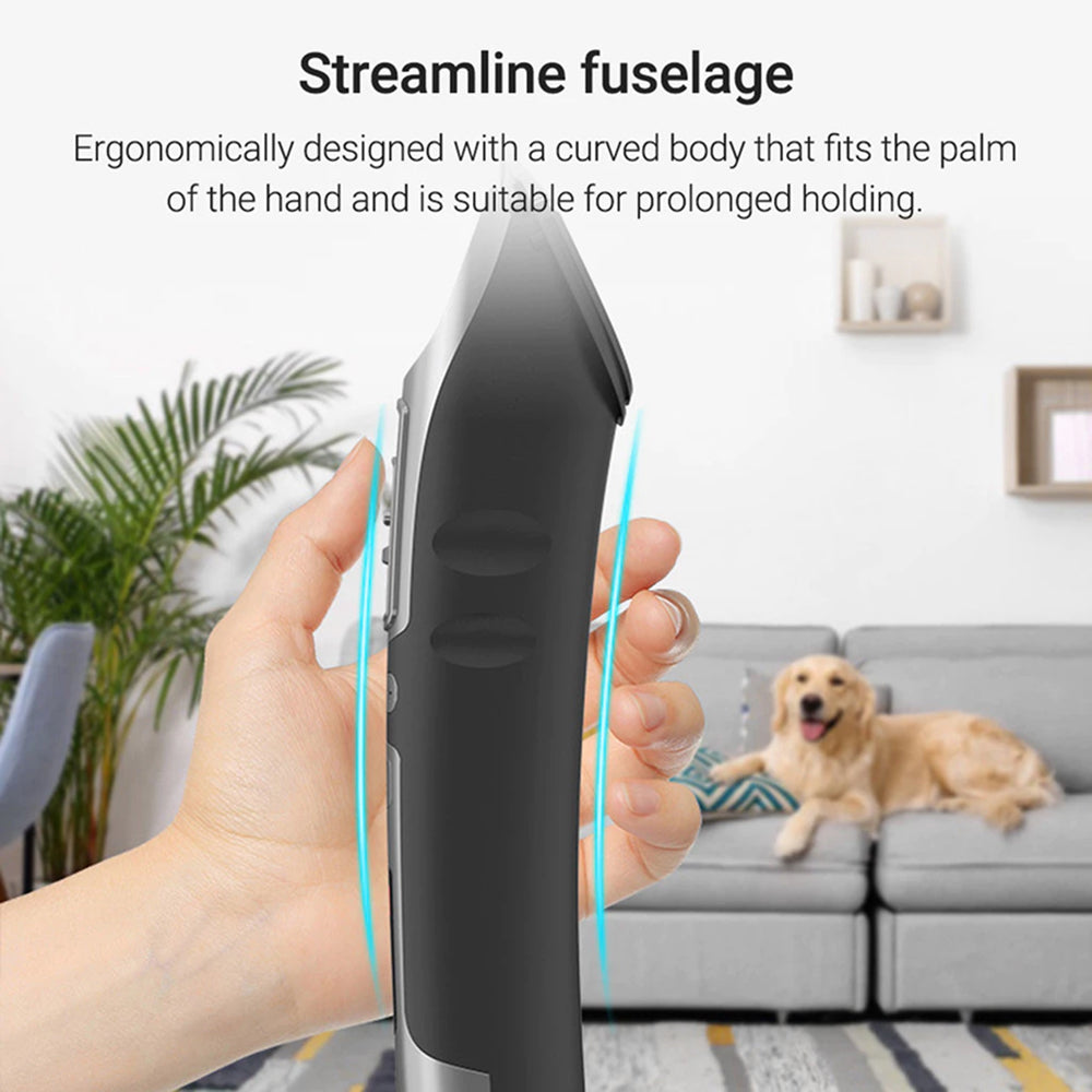 Hand holding a FuriCutx Dog Hair Clipper with a dog in the background