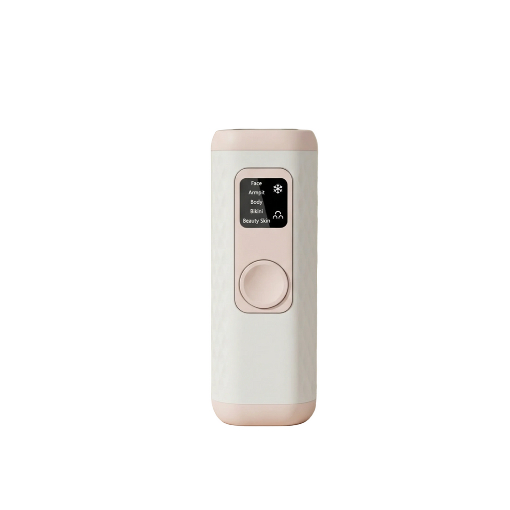 A Gloreine IPL Hair Removal Device with a white marble-patterned body and pale pink trim, standing on a marble tray in a styled interior scene with flowers and eggs nearby.