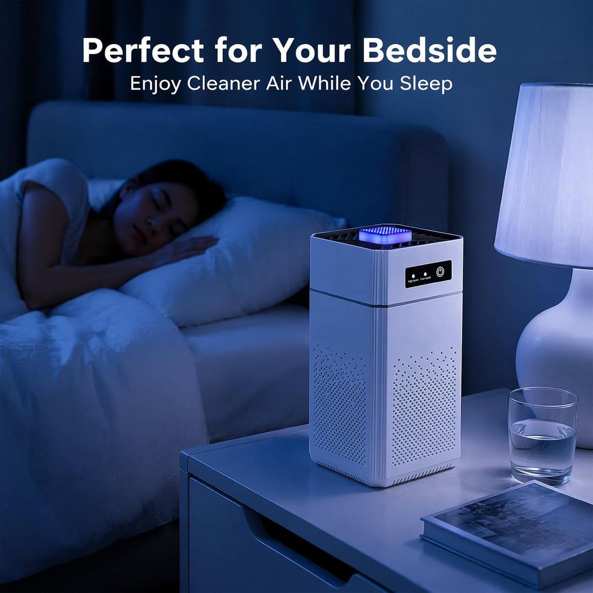 A white Hilio Aera Air Purifier with a blue illuminated top fan sits on a bedside table next to a sleeping person in bed, with a lamp and glass of water nearby. Text at the top reads, 'Perfect for Your Bedside.