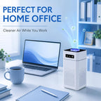 A white desktop Hilio Aera Air Purifier with a blue glowing top grille sits on a light desk beside a laptop, notebook, and mug in a bright home office setting. Large text reads 'PERFECT FOR HOME OFFICE' and 'Cleaner Air While You Work.