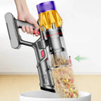 Handheld Hilio Cotair Pro Vacuum Cleaner pet food from a bowl with a clear compartment showing collected debris.