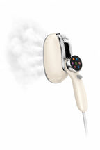 A Hilio Storro Steamer in cream and silver, shown with a plume of steam on a clean white background.