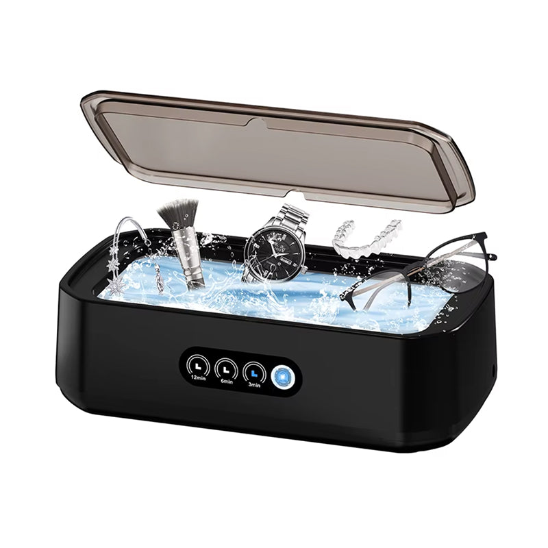 Black JewelyClin Ultrasonic Jewellery Cleaner with items being cleaned inside on a white background