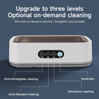 Portable JewelyClin Ultrasonic Jewellery Cleaner with control panel on a dark blue background