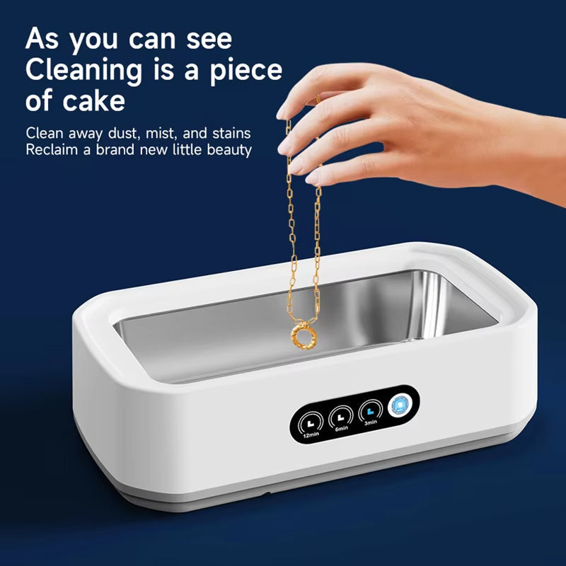 JewelyClin Ultrasonic Jewellery Cleaner device with a hand holding a gold chain against a blue background