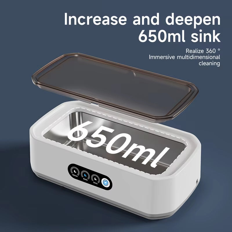 White JewelyClin Ultrasonic Jewellery Cleaner with a 650ml capacity on a dark blue background