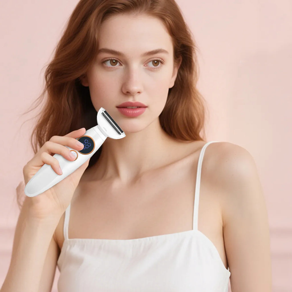 woman holding a white Krevont Bikini Trimmer device against a pink background