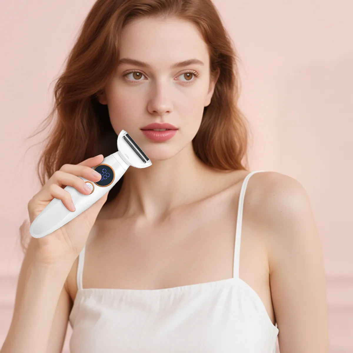 woman holding a white Krevont Bikini Trimmer device against a pink background