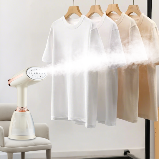 White t-shirt hanging on a rack with a Krevont Steamer next to it.