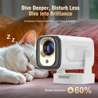 LuxovBeam Projector with a lens on a surface, with text about noise reduction and a cat sleeping in the background.