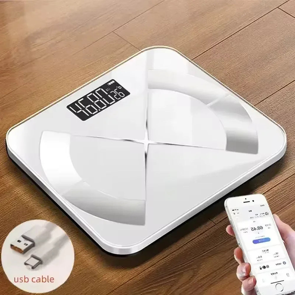 MillKindy Smart Body Scale on a wooden floor with a smartphone app interface.