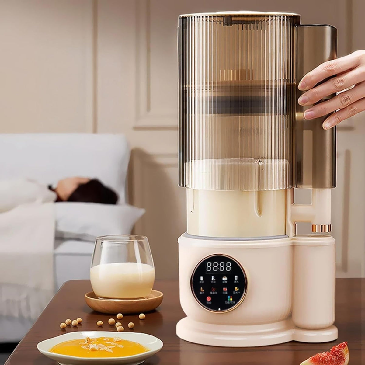 White kitchen NutyClax Nut Milk Maker with a digital display on a wooden table, surrounded by ingredients and a glass of milk.