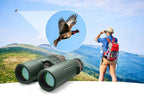 Person with Optinexo Ultra Binoculars observing a bird in a scenic outdoor setting