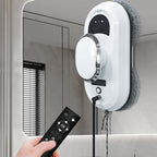 Cleaning RelleBont Robot Window Cleaner with remote control attached to a mirror