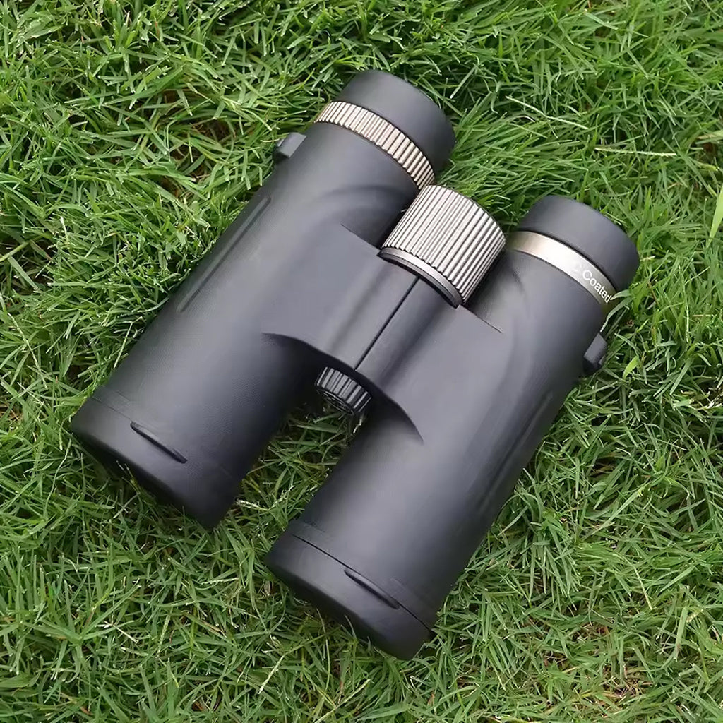 Pair of SawCleri Compact Binocular on a grassy surface