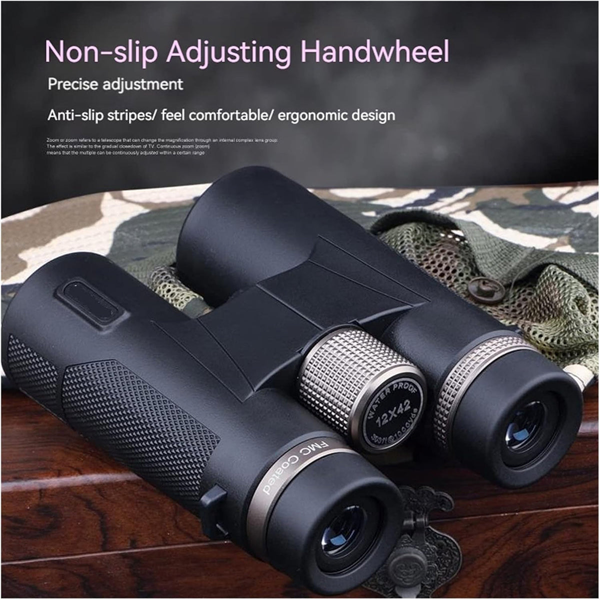Black SawCleri Compact Binoculars with adjusting handwheel on a wooden surface