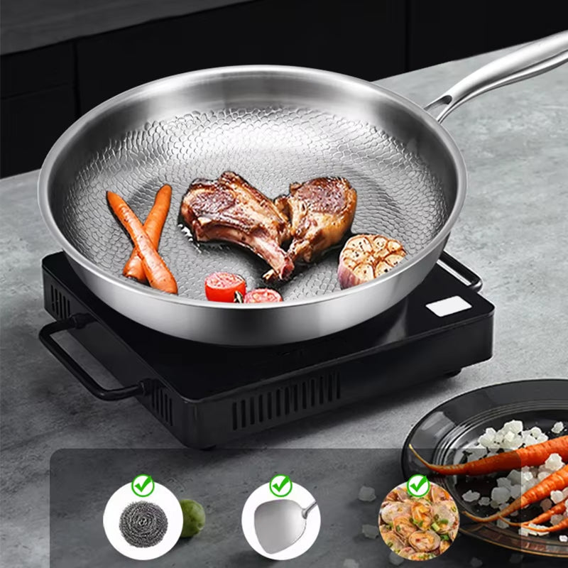 Stainless TikaxPan Titanium Frying Pan with food on a gray surface