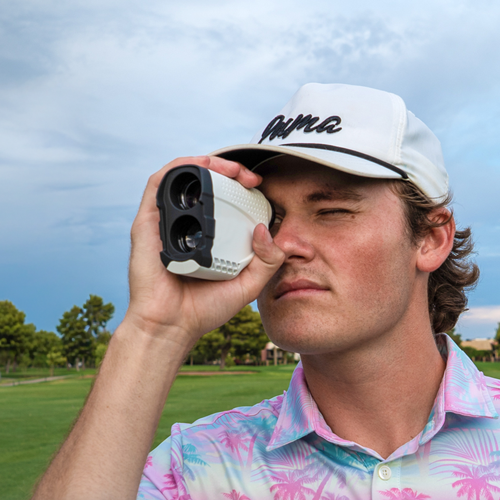 Man using a Tiverno Golf Rangefinder
 on a golf course