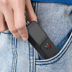 Hand inserting a small black VAKODA Pocket 3 Vlog Camera into a blue denim pocket