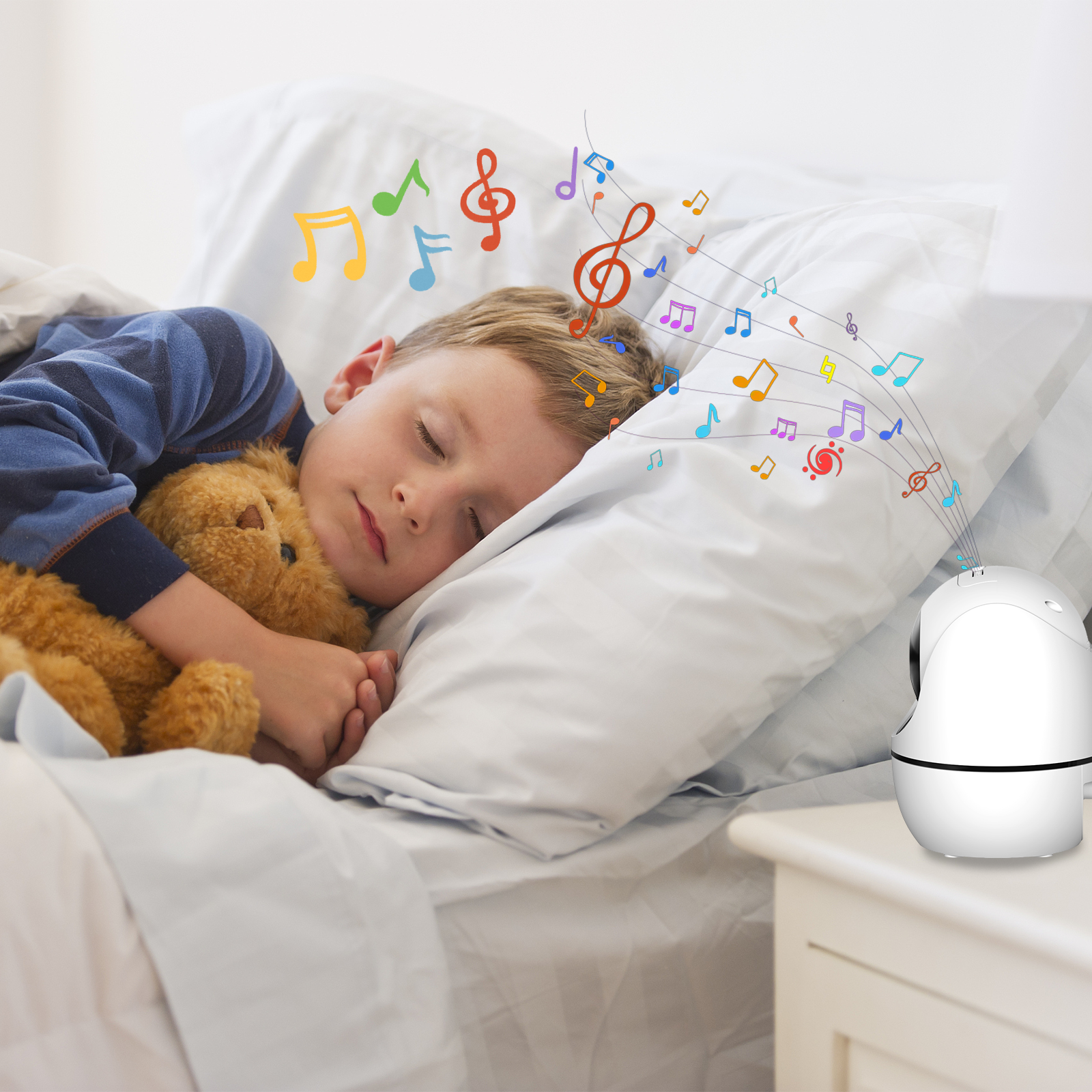 Child sleeping in bed with a teddy bear, colorful music notes on the pillow, and a white night light on the nightstand.