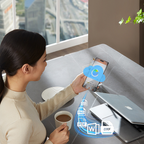 Woman using a smartphone with cloud icon at a desk with laptop and coffee cup.